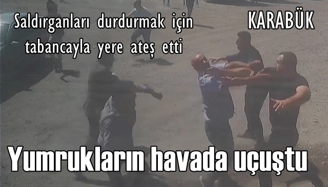 Saldırganları durdurmak için tabancayla yere ateş etti