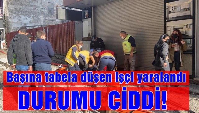 Başına tabela düşen işçi yaralandı