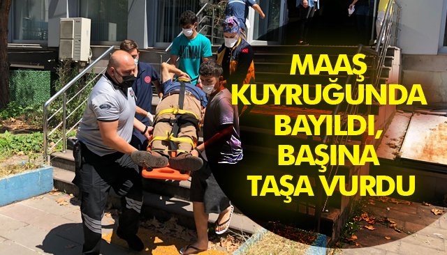 MAAŞ KUYRUĞUNDA BAYILDI, BAŞINA TAŞA VURDU 