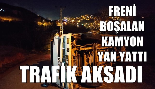 Freni boşalan kamyon yan yattı