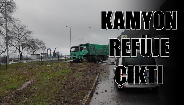  Yoldan çıkan kamyon refüje çıktı