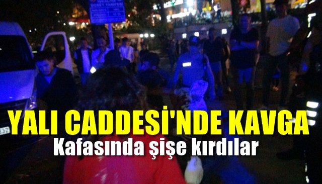 Kafasında şişe kırdılar