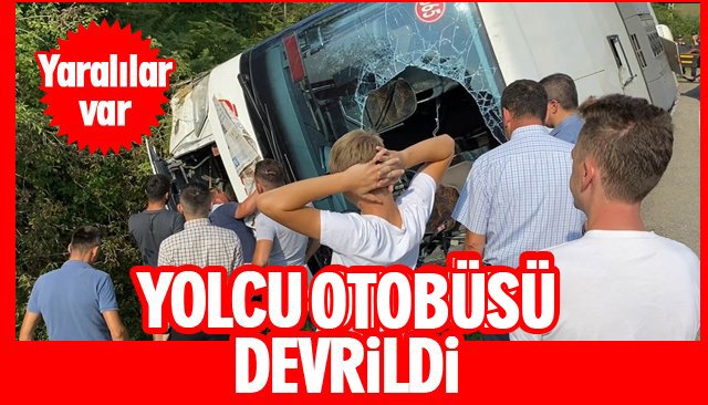 YOLCU OTOBÜSÜ DEVRİLDİ; YARILALAR VAR